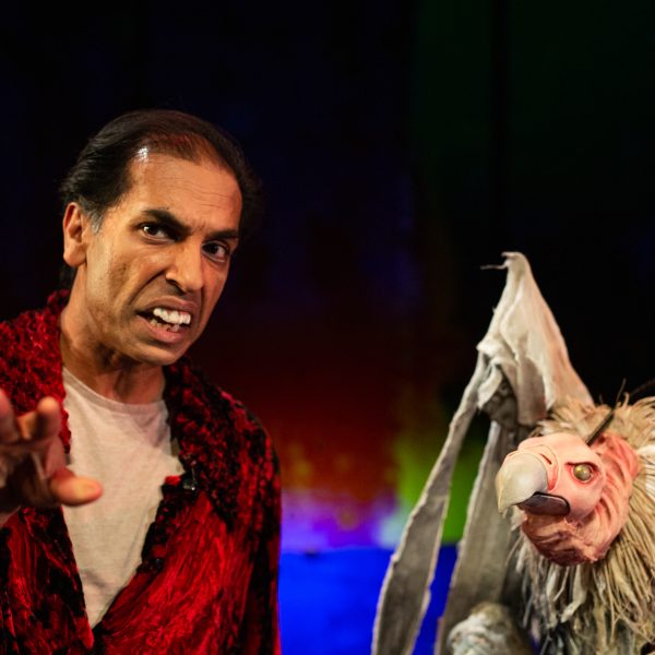 Actor Jacob Rajan looks at the camera in an conversation with Gerry the vulture puppet