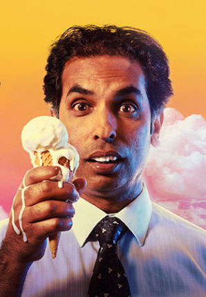 Actor Jacob Rajan looking confused while holding a melting ice cream cone