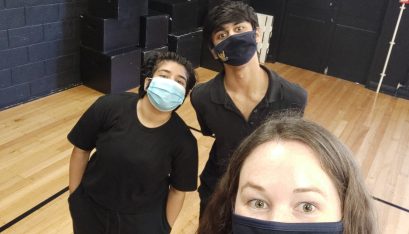 Mt Roskill teacher Emma Gillies and students stand for a selfie in their drama room