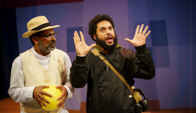 Jacob Rajan on the left with a yellow ball, while Jehangir Homavazir gestures around him.