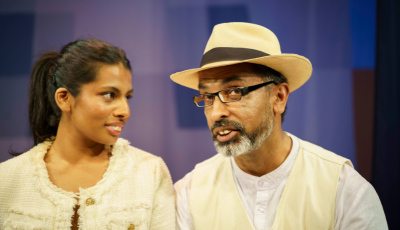 Alisha Jacob on the left looking at Jacob Rajan on the right